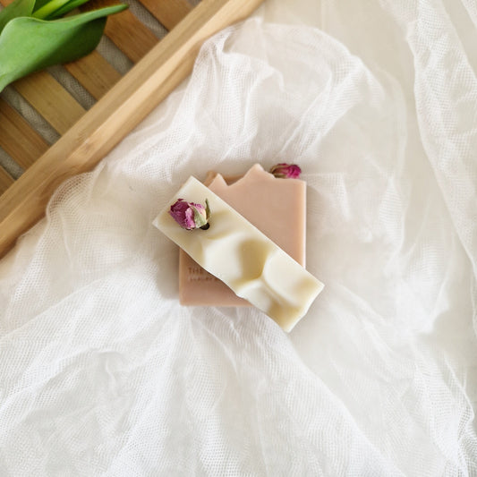 Bloom soap with Jasmine, geranium, and cedarwood essential oils. White soaps with dried rose buds decoration. Handmade coldprocessed soap by The Eden Collections