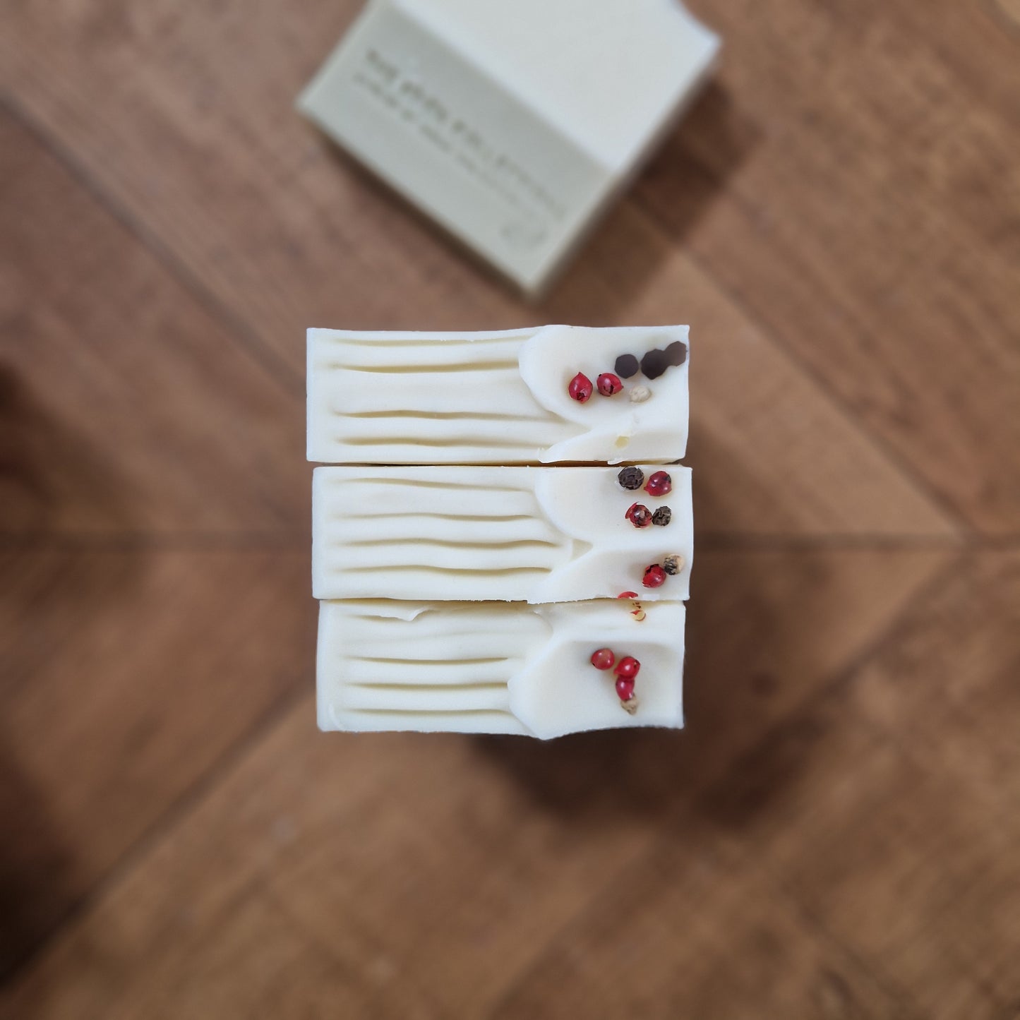 The Eden Collections' natural Herb Garden soap is photographed from the top to highlight the dried peppercorn decoration.