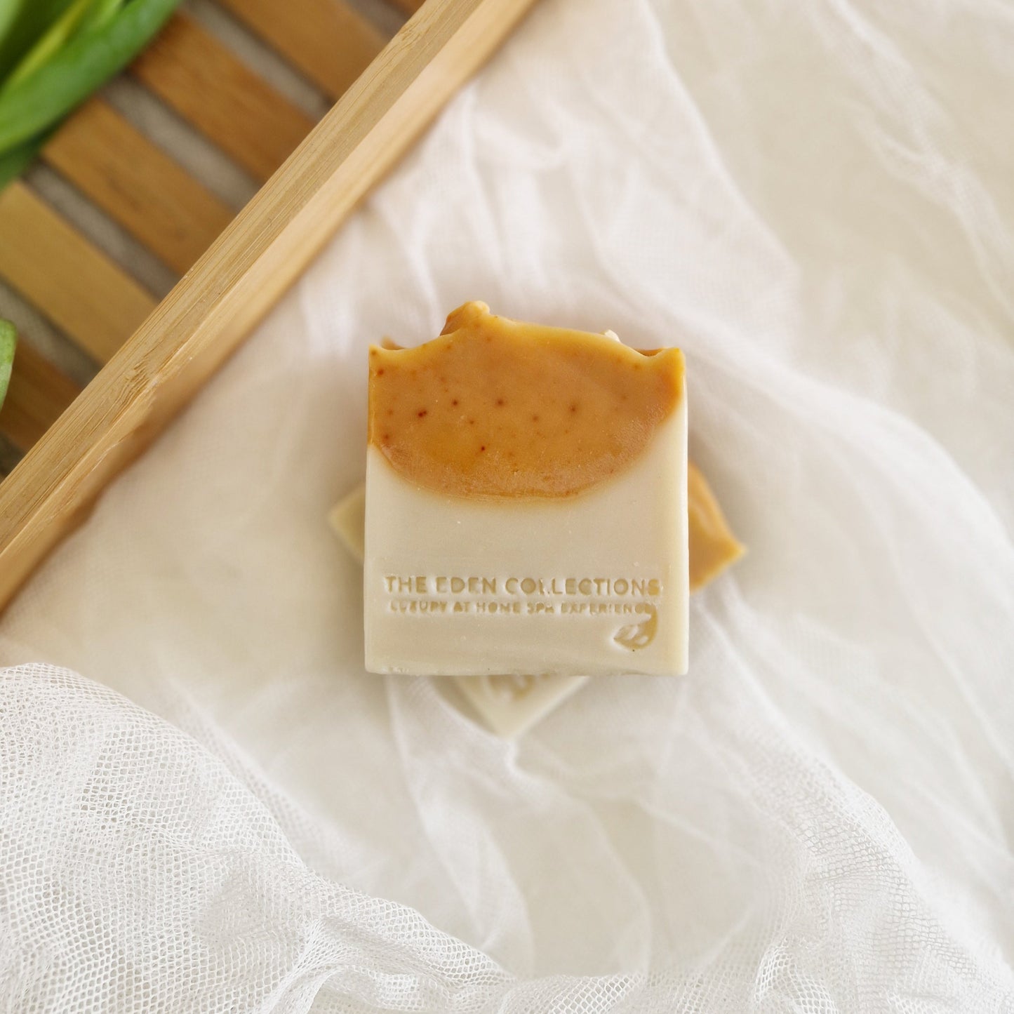 Handmade natural soap with kaolin clay and turmeric. Citrus scent with orange and may chang essential oils. Made in UK by The Eden Collections