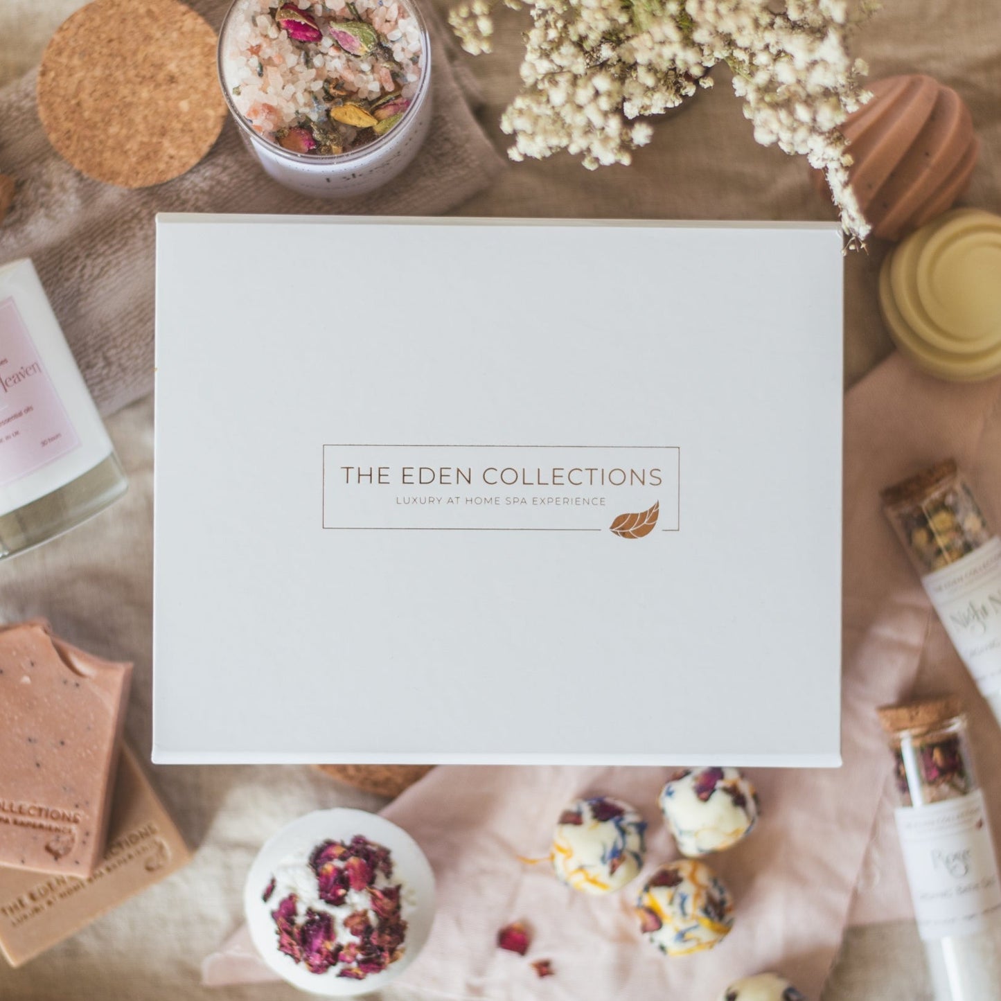 Beautiful, high quality, luxury gift box with rose gold foil on the top. Pure white box with The Eden Collections logo on it.