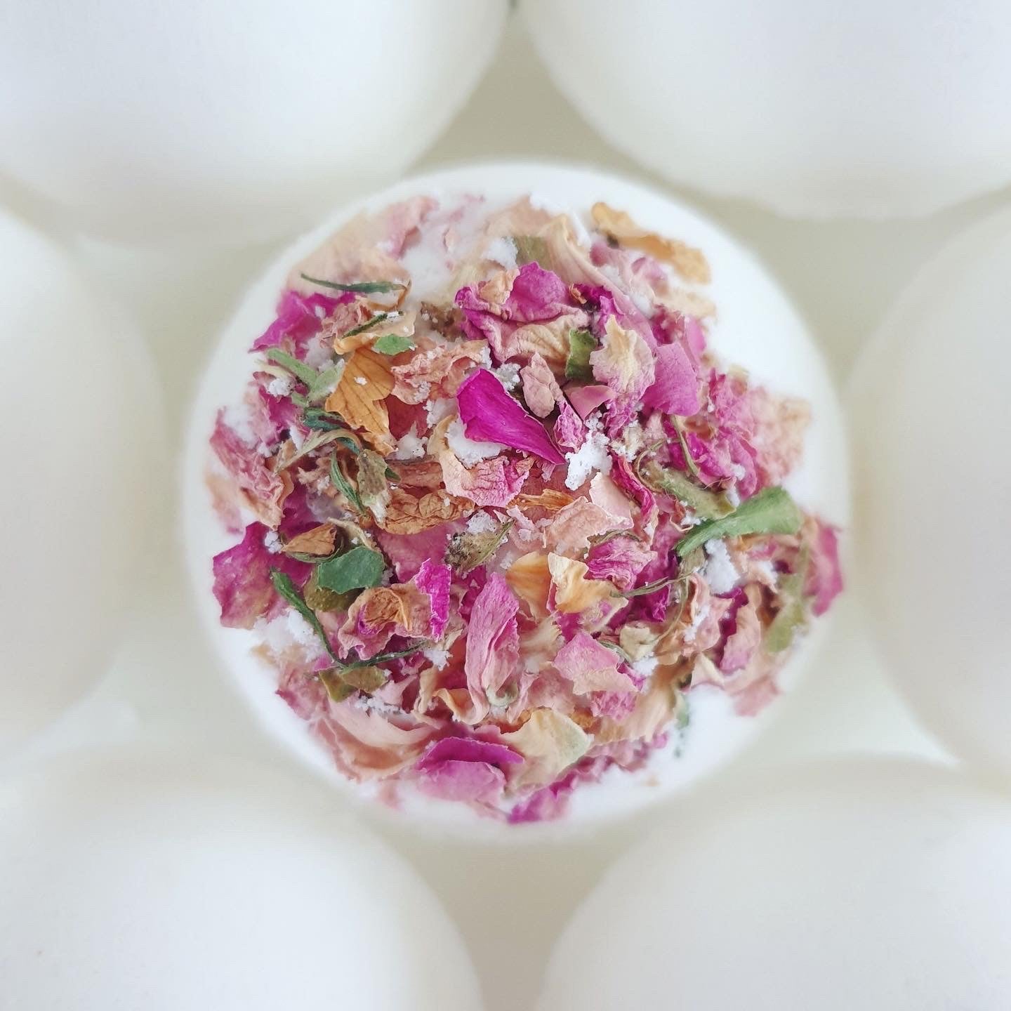 The Eden Collections Secret Bath Bomb for children with a hidden resin figurine inside. Plastic free, chemical free bath bombs for children.
