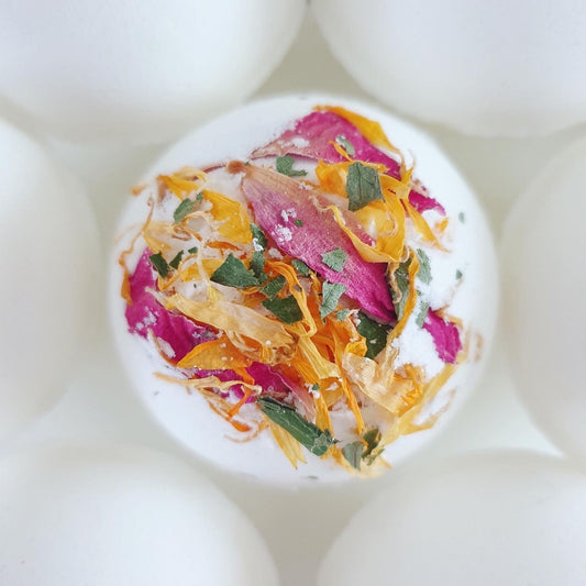 A close up photograph of the Floral Relief Secret Bath Bomb, displaying the flower petals included in the bath bomb.