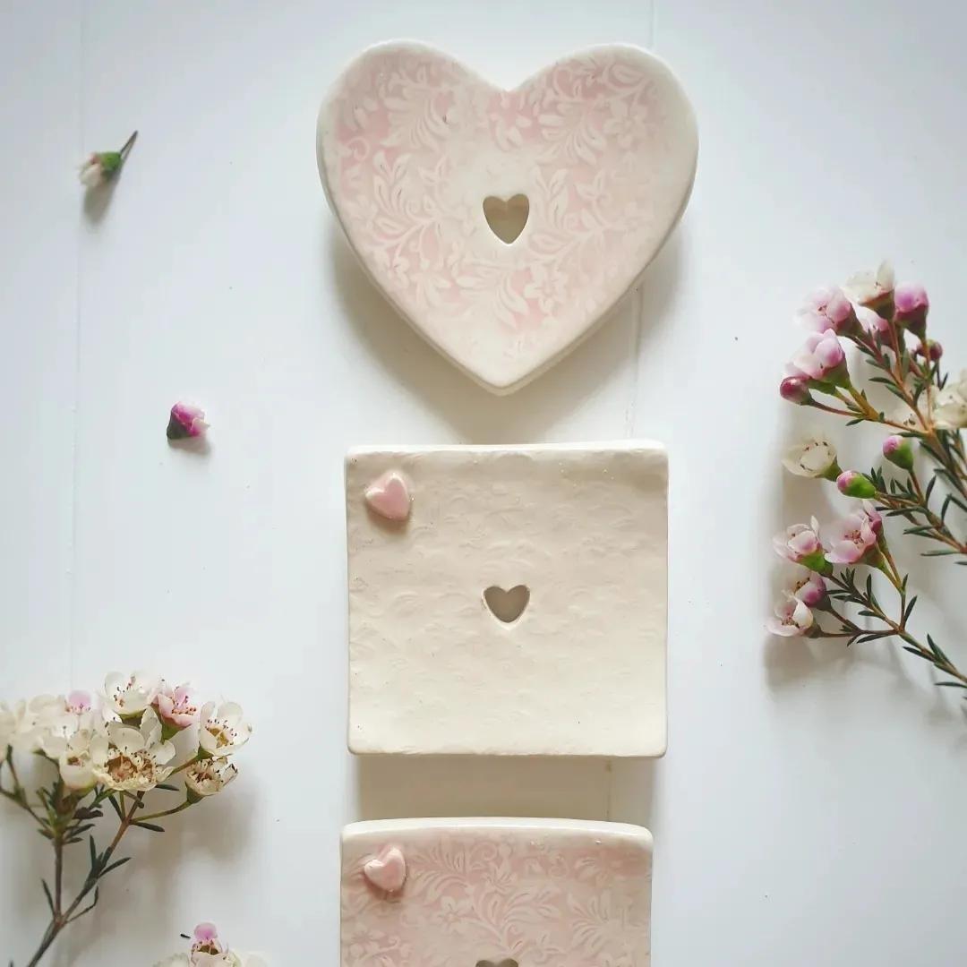 The Eden Collections range of handmade ceramic soap dishes, featuring floral, cream, and pink dishes. 