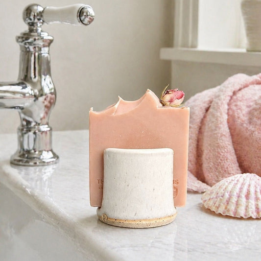 Handmade ceramic upright soap holder in a bathroom.