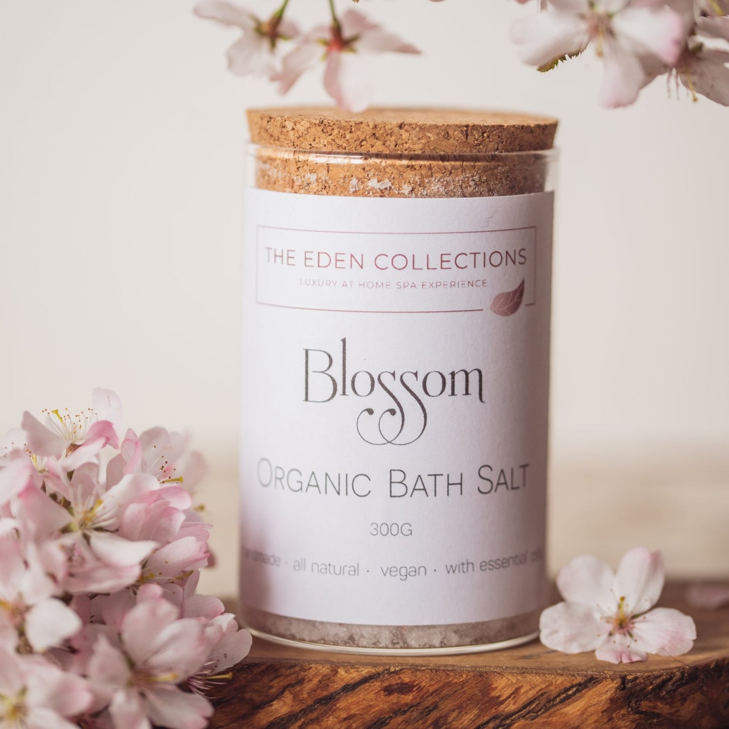 Organic Bath Salt in a glass tube with cork lid. Photographed with blossoms, made by The Eden Collections. 