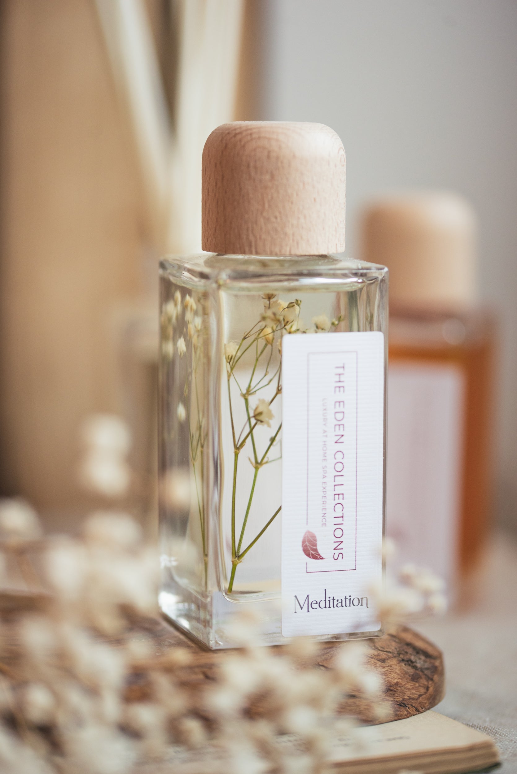 Aromatherapy reed diffuser with calming essential oil blend. Elegant glass jar with wooden lid, decorated with dried botanicals, hand poured by The Eden Collections in Wales.