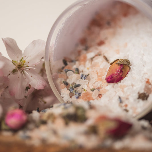 Organic Bath Salt with dried rose and lavender buds, scented with pure essential oils. Photographed with blossom decoration, made by The Eden Collections.
