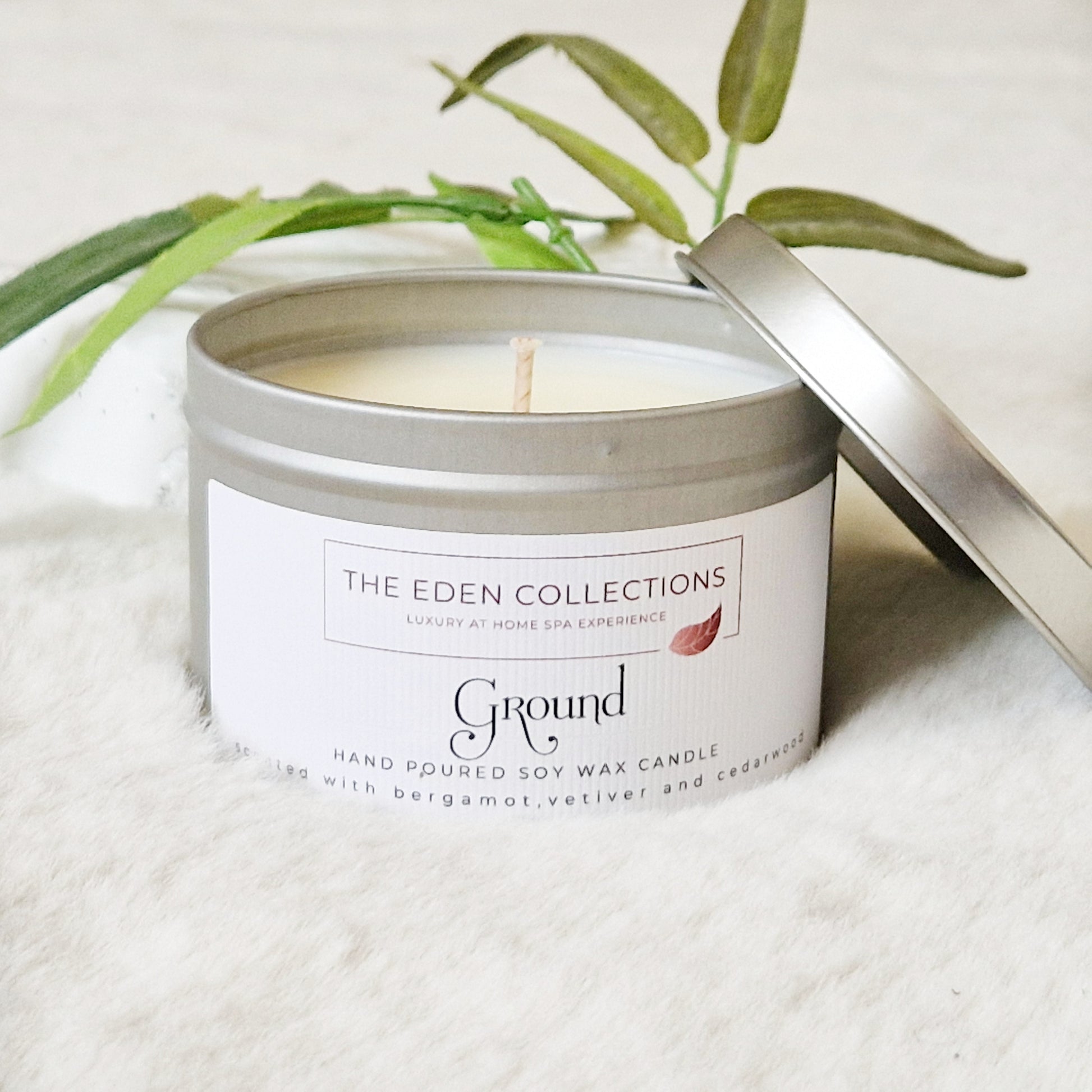 Soy candle in silver tin, scented with essential oil, hand poured by The Eden Collections.