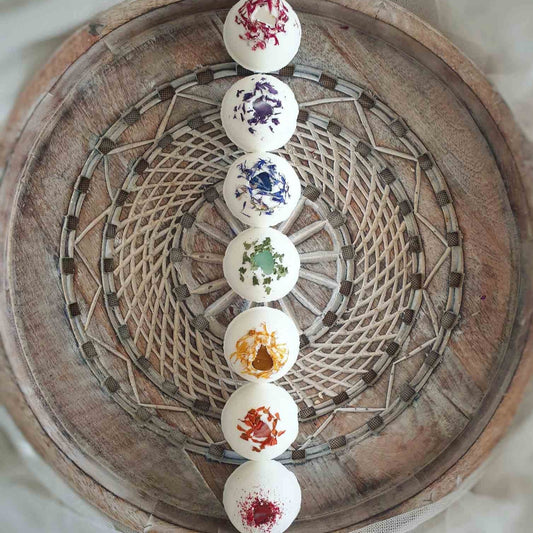 The Chakra Healing Secret Bath Bomb set with healing crystals, organic butters, pure essential oil blends and hidden affirmations, handmade made by The Eden Collections.