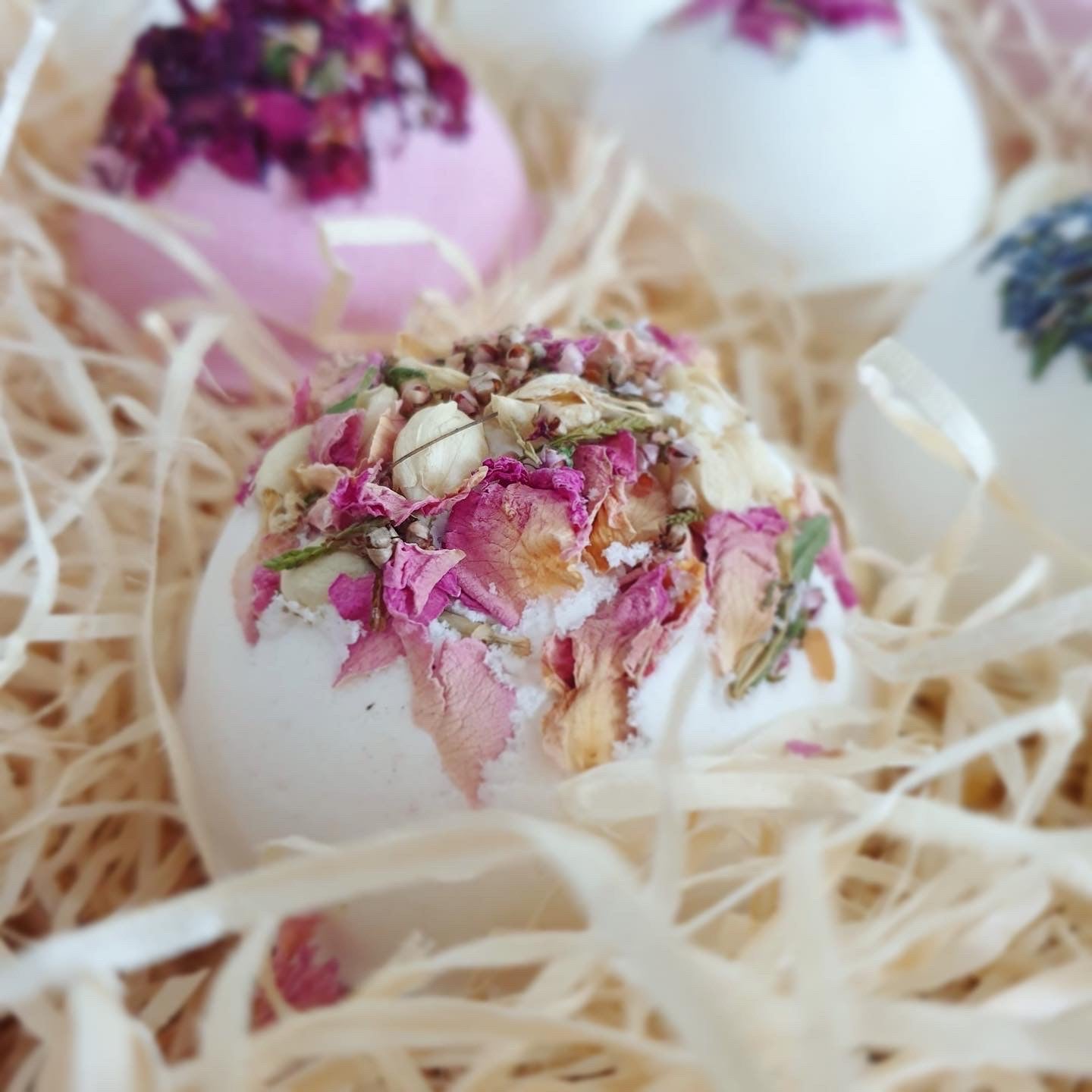 Posy Secret Bath Bomb, decorated with botanicals, enriched with organic butters. Available in a pack with other all natural bath bombs by The Eden Collections